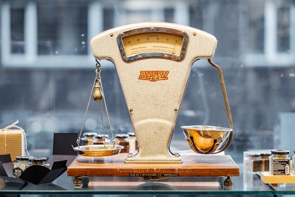 A set of old fashioned scales, balancing two wieghts